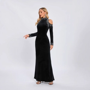 Elegant black velvet cut-out maxi dress with pearl trim and chic off-shoulder design
