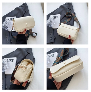 Detailed views of a white pebble leather crossbody bag with a colorful peacock strap