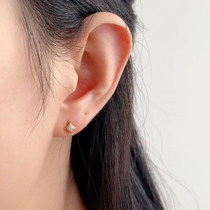 Minimalist S925 sterling silver gold star stud earrings with zirconia on female model