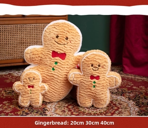 Three sizes of gingerbread man plush pillows with soft texture and bow embroidery