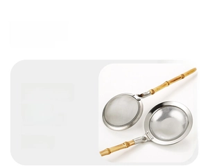 Close-up of fine mesh strainer with natural bamboo handle for skimming foam and residue