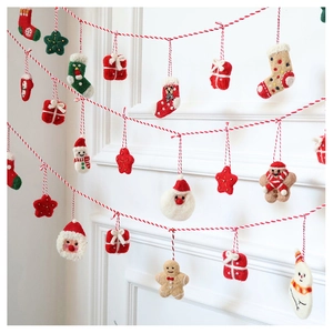 Festive wool felt Christmas ornaments with Santa, snowman and gingerbread man hanging