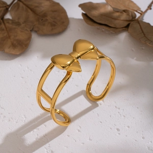 Bracelet jonc ouvert en acier inoxydable plaqué or 18 carats avec design de nœud
