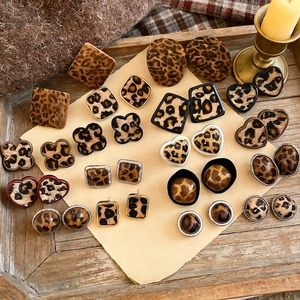 Vintage style leopard print stud earrings in various geometric shapes with metal edges