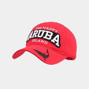 Close-up of red washed cotton golf cap with Aruba One Happy Island 3D embroidery detail