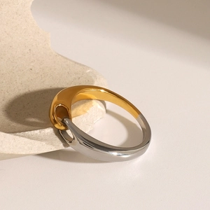 Minimalist two-tone stainless steel ring with a streamlined buckle design in gold and silver