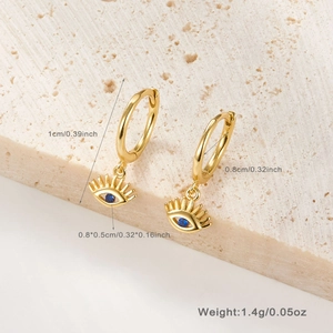 Macro detail of S925 sterling silver gold earrings with blue eye charms and dimensions