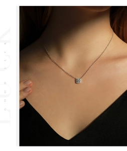 Close-up of S925 silver square halo pendant necklace with 1ct moissanite on a model