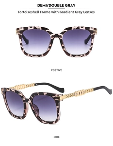 Detail of tortoiseshell sunglasses with purple gradient lenses and gold chain temples