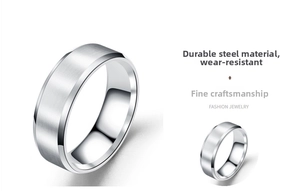 Macro shot of brushed stainless steel ring with polished beveled edges and zircon inlay
