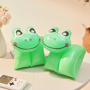 Detail of green frog-shaped inflatable swim arm bands for kids made of durable PVC material