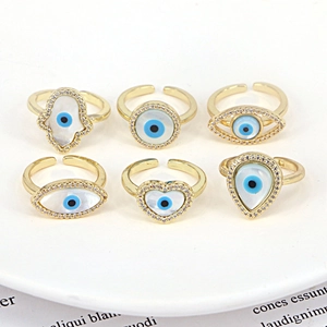Set of 6 gold adjustable Evil Eye and Hamsa rings with shell and cubic zirconia stones