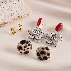 Detail of 6-piece resin earring set featuring floral patterns, fish studs, and leopard prints