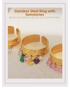 Detail of 18K gold stainless steel open ring with colorful pear-cut zircon pendants