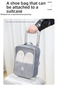 Gray travel shoe bag with luggage strap and mesh pocket showing white slippers inside