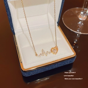 Gold lightning and heart heartbeat pendant necklace with zircon in a blue jewelry box