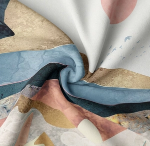 Macro shot of abstract mountain print tapestry showing soft fabric texture and draping