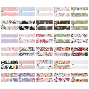 Selection of 30 floral fabric snap hair clips in various patterns and colors