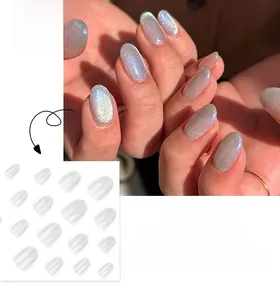 Detail of short round pearl white aurora cat eye press-on nails with shimmer finish