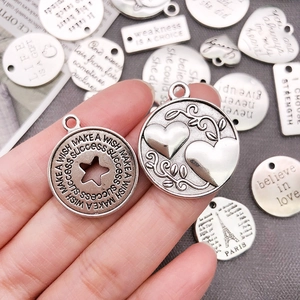 Vintage silver alloy charms with engraved motivational quotes for DIY jewelry making