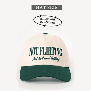 Close-up of NOT FLIRTING embroidery on a two-tone baseball cap in cream and forest green
