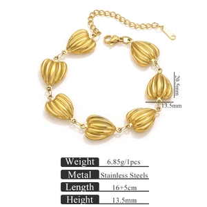 Detail view of heart-shaped shell textured stainless steel bracelet with dimensions