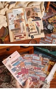 Close-up of vintage PET stickers with botanical designs and retro quotes on an old book