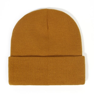 Detailed close-up showing the fine knit texture and folded cuff of the ginger beanie