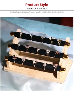 Three-tier velvet jewelry display stand showing a variety of elegant fashion rings