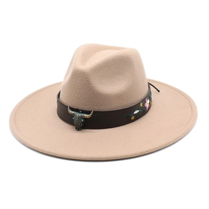 Detail of western fedora hat with floral embroidery and bull head metal ornament