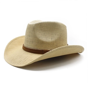 Straw western cowboy hat in beige with wide brim and brown faux leather band decorative