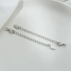 Close-up of 14K gold filled extender chain with lobster clasp and Hand Made tag