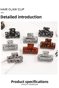 Detail of square Halloween hair claw clips with glitter finish, ghost and pumpkin patterns