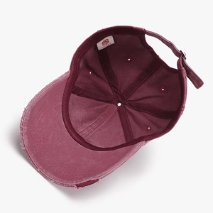 Detailed view of the internal adjustable buckle and stitching of the washed cotton cap
