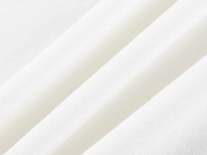 Close-up of premium white twill fabric texture showing soft weave for V-neck T-shirt