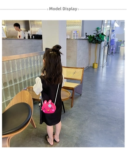 Girl's pink rabbit silicone crossbody bag with floral detail on a white braided strap