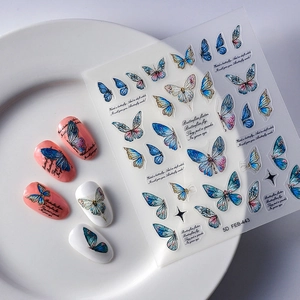 Vibrant 5D butterfly nail art stickers with embossed textures and colorful DIY designs