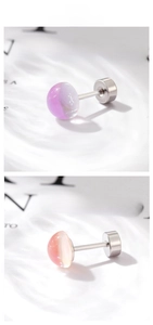 Detail of faux moonstone screw earrings in lilac and peach gradient finishes