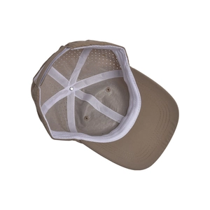Detail view of the khaki baseball cap interior structure with stitching and vent holes