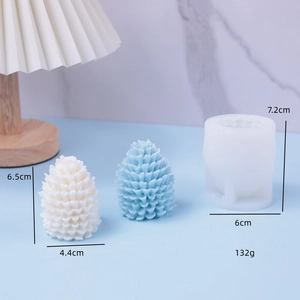 DIY pinecone silicone candle mold for Christmas with white and blue finished samples