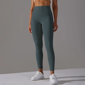 Detail of high-waisted seamless yoga leggings in dark blue grey with butt-lifting design