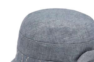 Close-up of high-quality cotton-linen fabric with breathable texture on elderly women hat