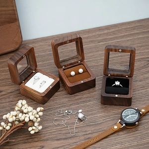 Walnut wood jewelry box with glass lid and velvet lining for rings and earrings