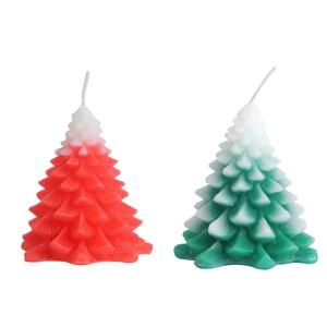 Creative Christmas tree shaped candles in green and red gradient for festive decor