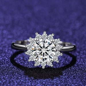Macro shot of silver round brilliant-cut zircon ring with floral halo setting
