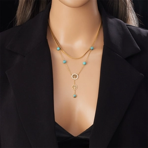 Double-layered gold titanium steel necklace with turquoise beads and Tree of Life pendants