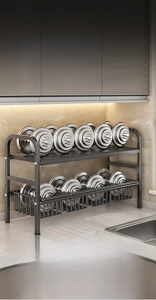 Detail of the heavy-duty double-layer black metal rack holding weights to show strength