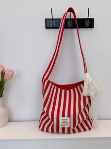 Red and white striped canvas tote bag with delicate lace trim and a wide shoulder strap