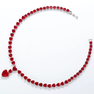 Detailed view of luxury red heart-shaped gemstone necklace with matching pendant