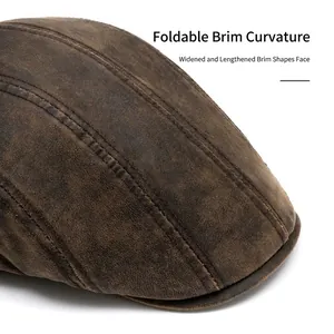 Vintage brown leather newsboy cap with widened foldable brim and stitched details